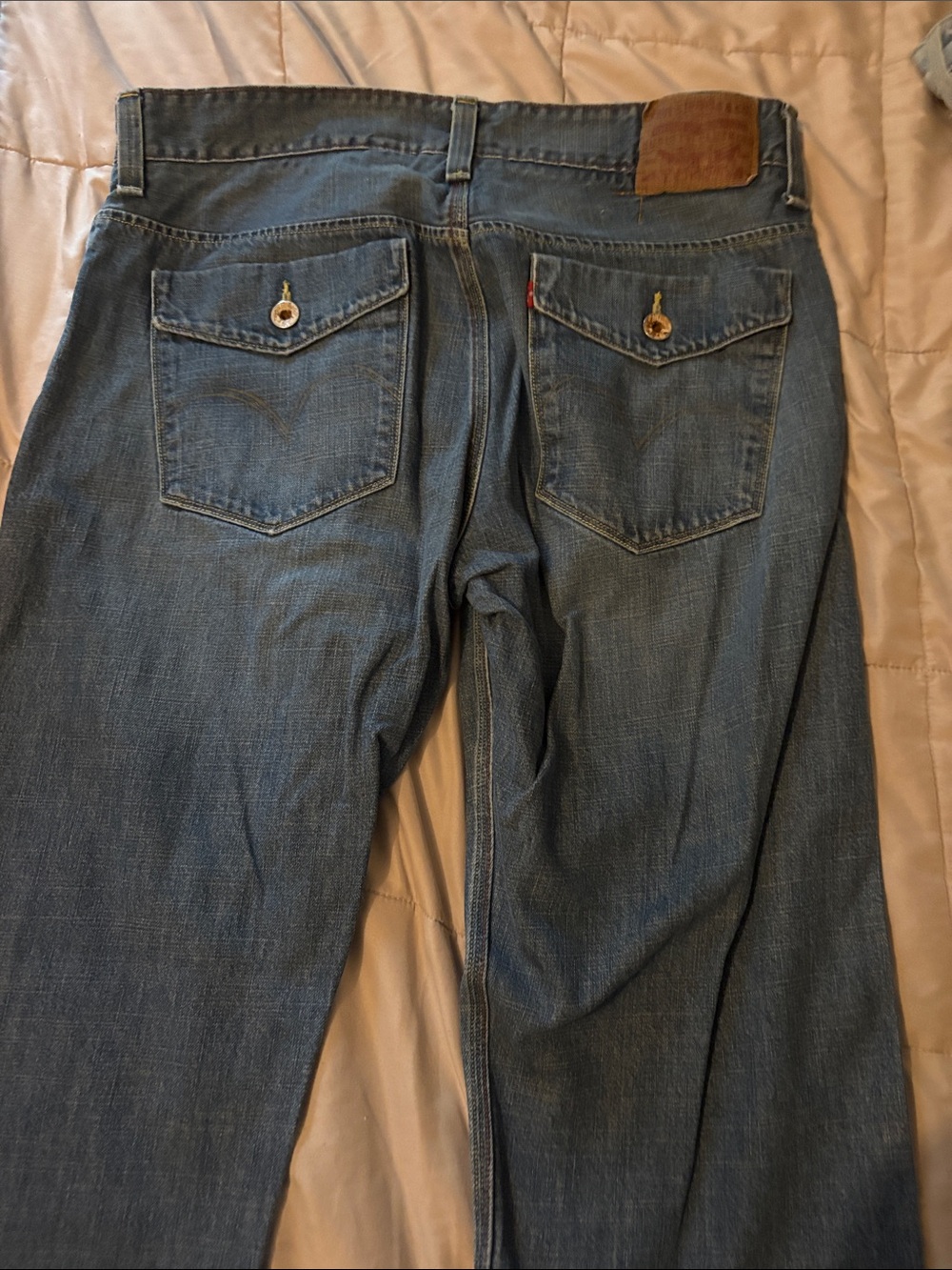 Levi's Slim Straight Jeans in Classic Blue Denim with Button-Flap Back Pockets